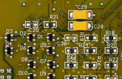 Typical SMT board with transistors, and passive components A typical surface mount board showing the different types of smaller components including resistors, transistors, etc.