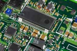 SMT board with typical IC packages An image of a PC board containing surface mount components, showing the typical components used including ICs and other smaller components.